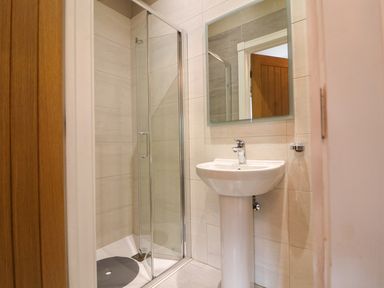 A bathroom with a sink and shower at Northumberland Luxury Stays - The Chivits near Amble