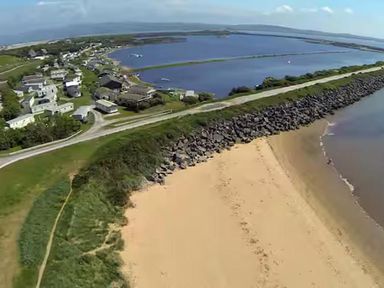 An aerial view of a beach and residential area at Port Haverigg Cabin Sleeps 4 Steel Green near Haverigg