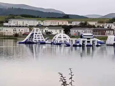 An inflatable water play area on a lake at Port Haverigg Cabin Sleeps 4 Steel Green near Haverigg