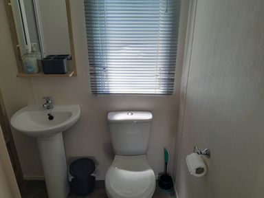 A bathroom with a toilet and sink at Ye Old'e Man - Sleeps 6 &amp; Pet Friendly near Flookburgh