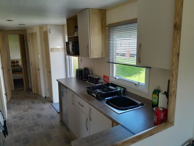 A kitchen with cabinets and a sink at Ye Old'e Man - Sleeps 6 & Pet Friendly Near Flookburgh
