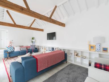 A living room with sofas and a television at Simple Coastal Luxury near Southwold sleeps 10 near Southwold