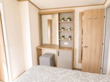 A bedroom with a mirror and shelves at Tattershall Lakes - Hot Tub - Sleeps 6 - Pets, Tattershall