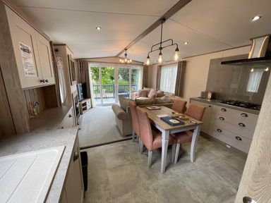 A living room and dining area with a sofa and table at unknown location