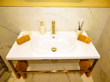 A sink with a faucet and towels on either side at Newly Refurbished Cottage, sleeping 4 and Central, Berwick-Upon-Tweed