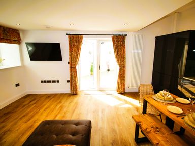 A dining room with a table and chairs at Newly Refurbished Cottage, sleeping 4 and Central Berwick-Upon-Tweed