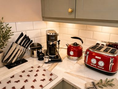 A kitchen with appliances and utensils at Muddy Boots – La Petite Mews in Kirby Stephen