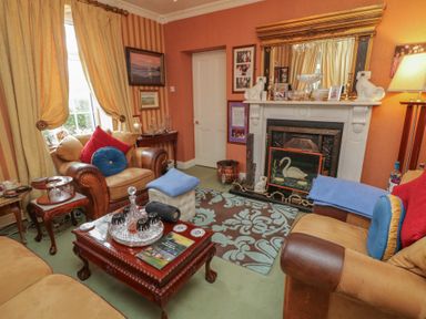 A living room with a sofa and coffee table at Bruckless Rest Fine Country Dining B&amp;B Bruckless