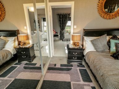 A bedroom with two beds and nightstands at Bruckless Rest Fine Country Dining B&amp;B Bruckless