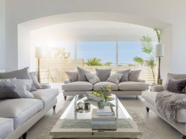 A living room with a coffee table and sofas at By The Sea in Newquay