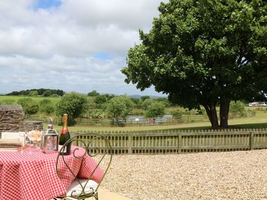 An outdoor area with a table and chairs at Beech Cottage in Truro