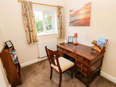 A study with a desk and chair at The Bungalow in Penrith