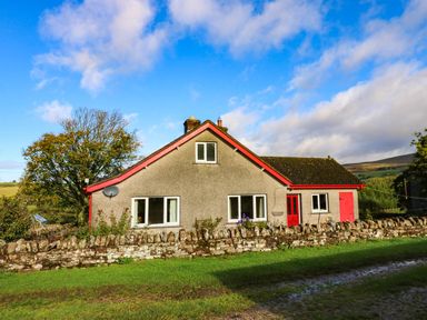 A house with windows and a door at The Bungalow in Penrith
