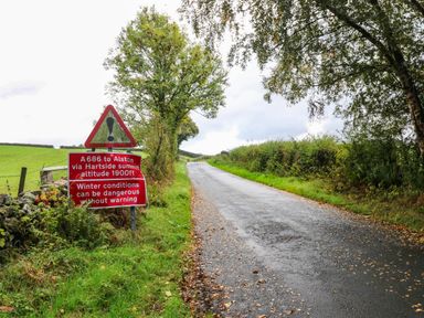 A road with a warning sign near Alston at The Bungalow in Penrith