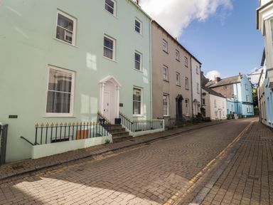 A row of houses on a street at Flat 2 Tenby