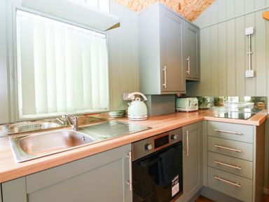 A kitchen with a sink and kettle at Calendonia Hut in West Mains near Haggerston