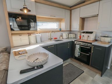 A kitchen with appliances and cabinets at 19 Finch