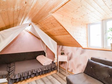 A bedroom with a bed and couch at Severnwolf House in Gloucester