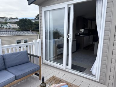 An outdoor seating area with a sofa and table at Club Sahara, Sandy Bay, Exmouth