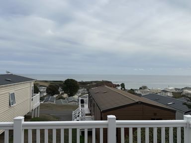 A view of houses and the sea from a deck at Club Sahara in Sandy Bay, Exmouth