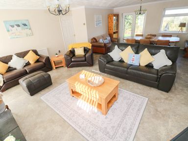 A living room with a sofa and coffee table at 24 Little Castle Grove Hubberston