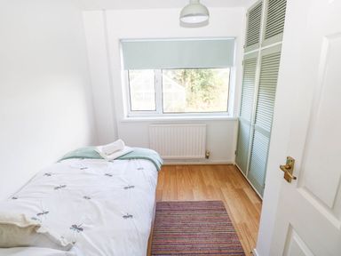 A bedroom with a bed and a window at 24 Little Castle Grove, Hubberston