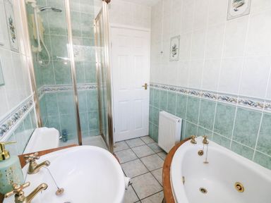 A bathroom featuring a shower and bathtub at 24 Little Castle Grove Hubberston