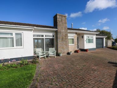 A house with a driveway and seating area at 24 Little Castle Grove, Hubberston