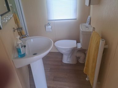 A bathroom with sink and toilet at Chapel Farm Holiday Park No 6 Bunnies View in Appleby-in-Westmorland