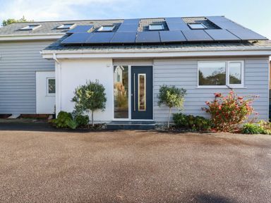 An exterior view of a house with solar panels at Harber Rise in Carlyon Bay