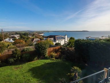 A garden overlooking the ocean and houses at Harber Rise in Carlyon Bay