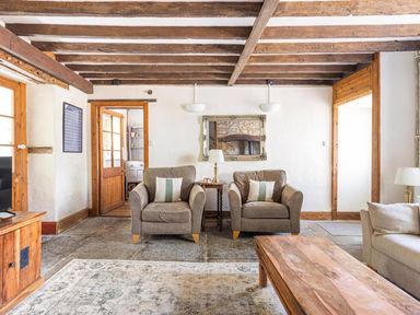 A living room with two armchairs and a coffee table at the property in location
