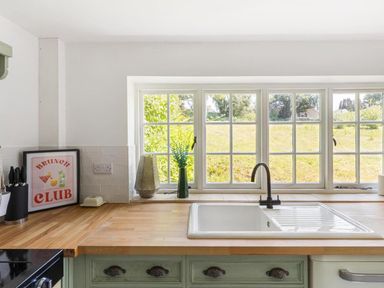 A kitchen with a sink and window at the property