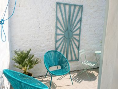 An outdoor seating area with chairs and a small table at the property