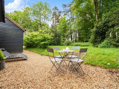 A garden with a table and chairs at a property