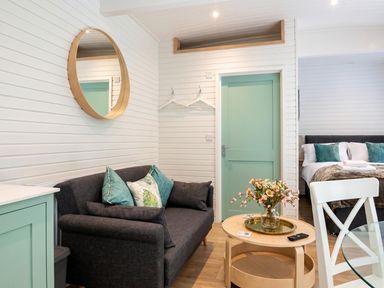 A living room with a sofa and a table at the property in location