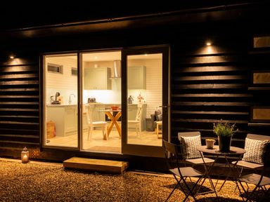 A kitchen with seating area visible from outside at 