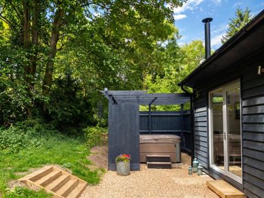 An outdoor area with a hot tub and steps at the property in 
