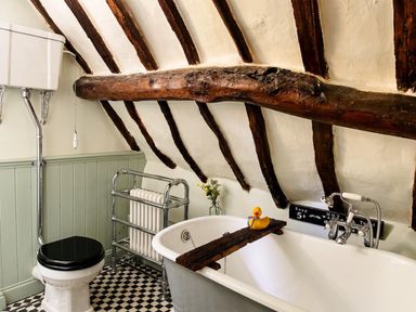 A bathroom with a bathtub and toilet at 