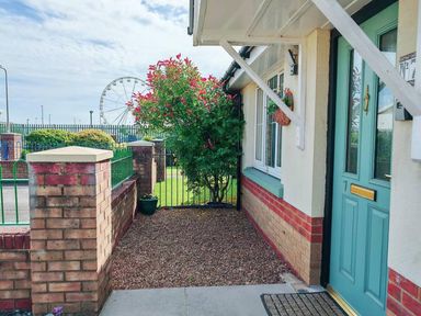 An outdoor area with a door and plants at the property