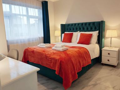 A bedroom with a bed and nightstands at 