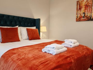 A bedroom with a bed and towels at 