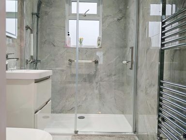 A bathroom with a shower and sink at The Old Barn in Manchester