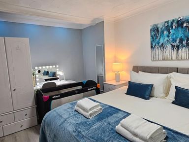 A bedroom with a bed and a mirror at the property