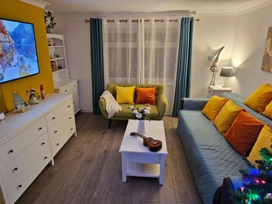 A living room with a sofa and coffee table at The Old Barn in Manchester