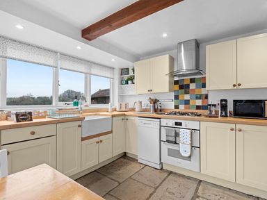A kitchen with sink, oven, and dishwasher at The Old Barn in Manchester