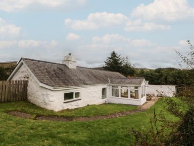 An exterior view of a house with garden at Bryn Eithin in Penygroes