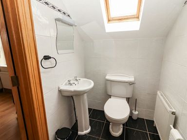 A bathroom with a sink and toilet at Wild Atlantic Ferry View, Kilrush, County Clare