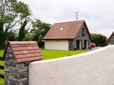 A house with a garden and car at Limavady Cherry Tree Apartment, Sleeps 2 and Parking, Limavady