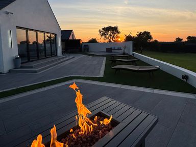 An outdoor patio with a fire pit and lounge chairs at Jeannies retreat at little lake fb